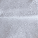 1970s Italian cotton jacquard bedspread with trim edge on bed