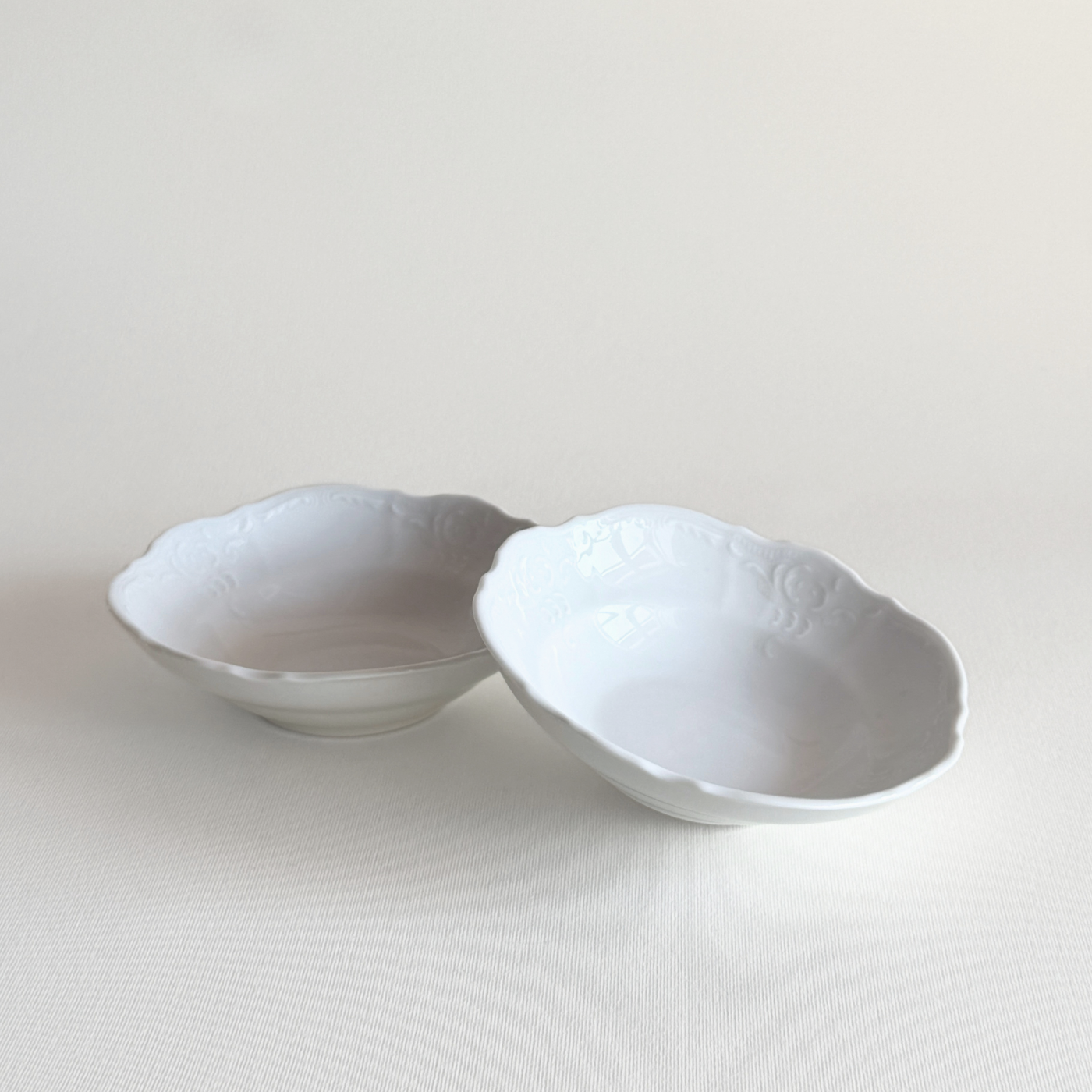 Bavarian porcelain bowls — set of 2, front view showing white relief decoration, KPM Bavarian production