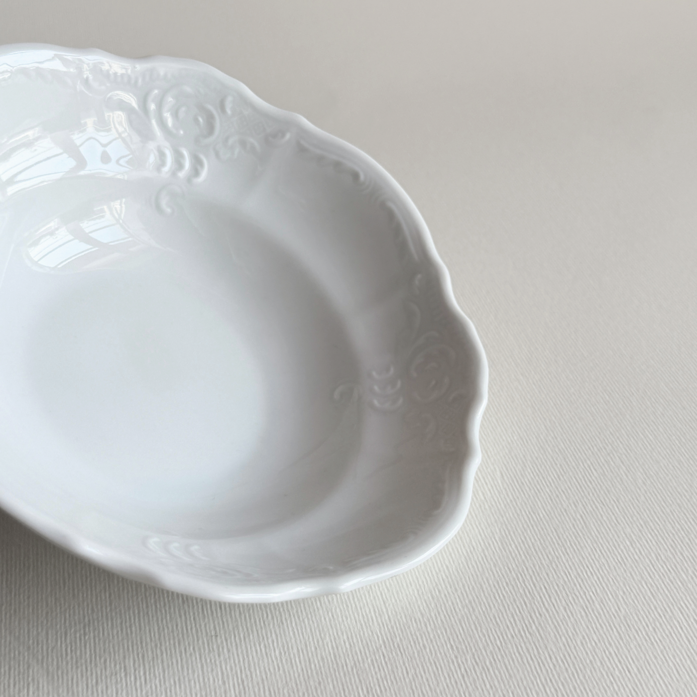 Bavarian porcelain bowls — close-up of relief decoration and white glaze surface detail