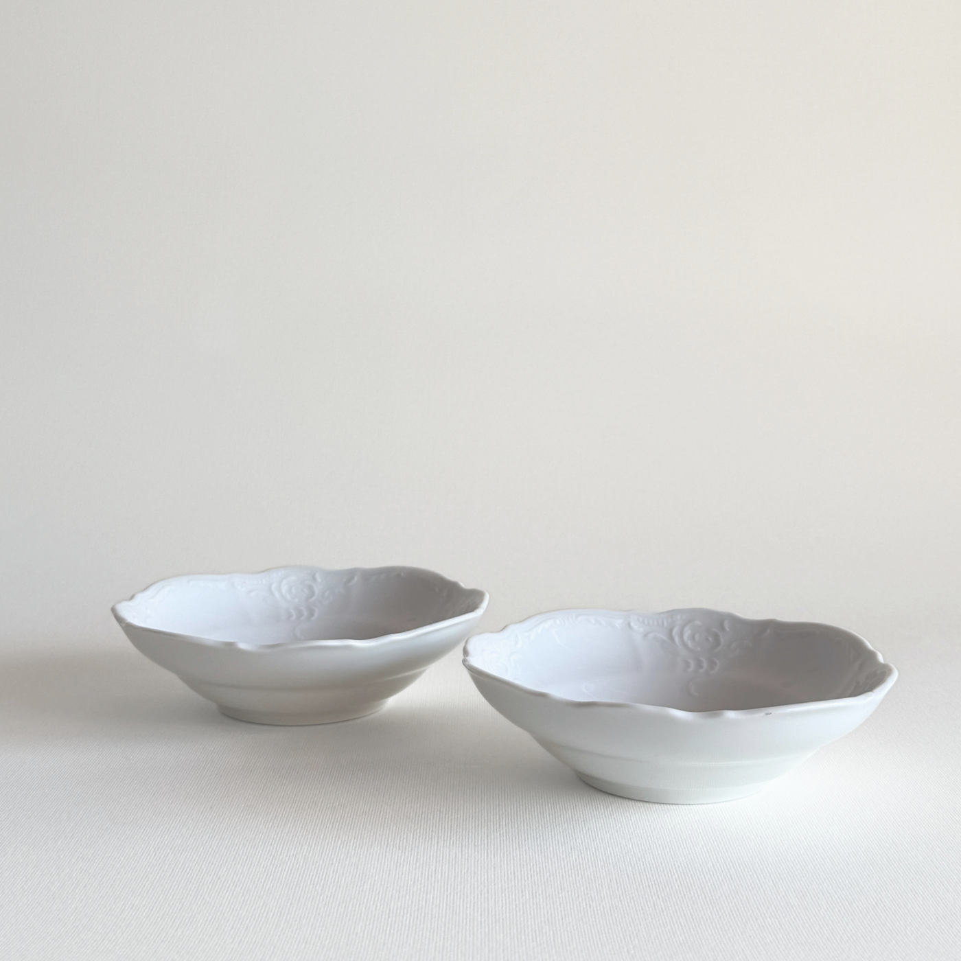 Bavarian porcelain bowls — stacked view showing set of 2 and white relief detail