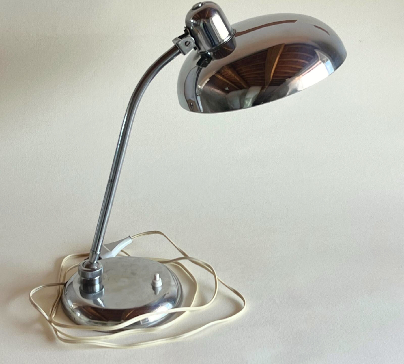 Functional chrome lamp in minimalist décor