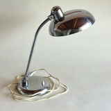 Functional chrome lamp in minimalist décor