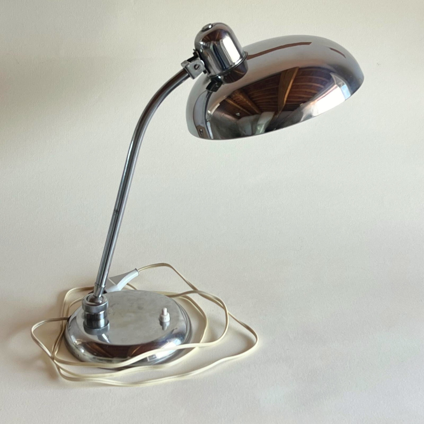 Functional chrome lamp in minimalist décor