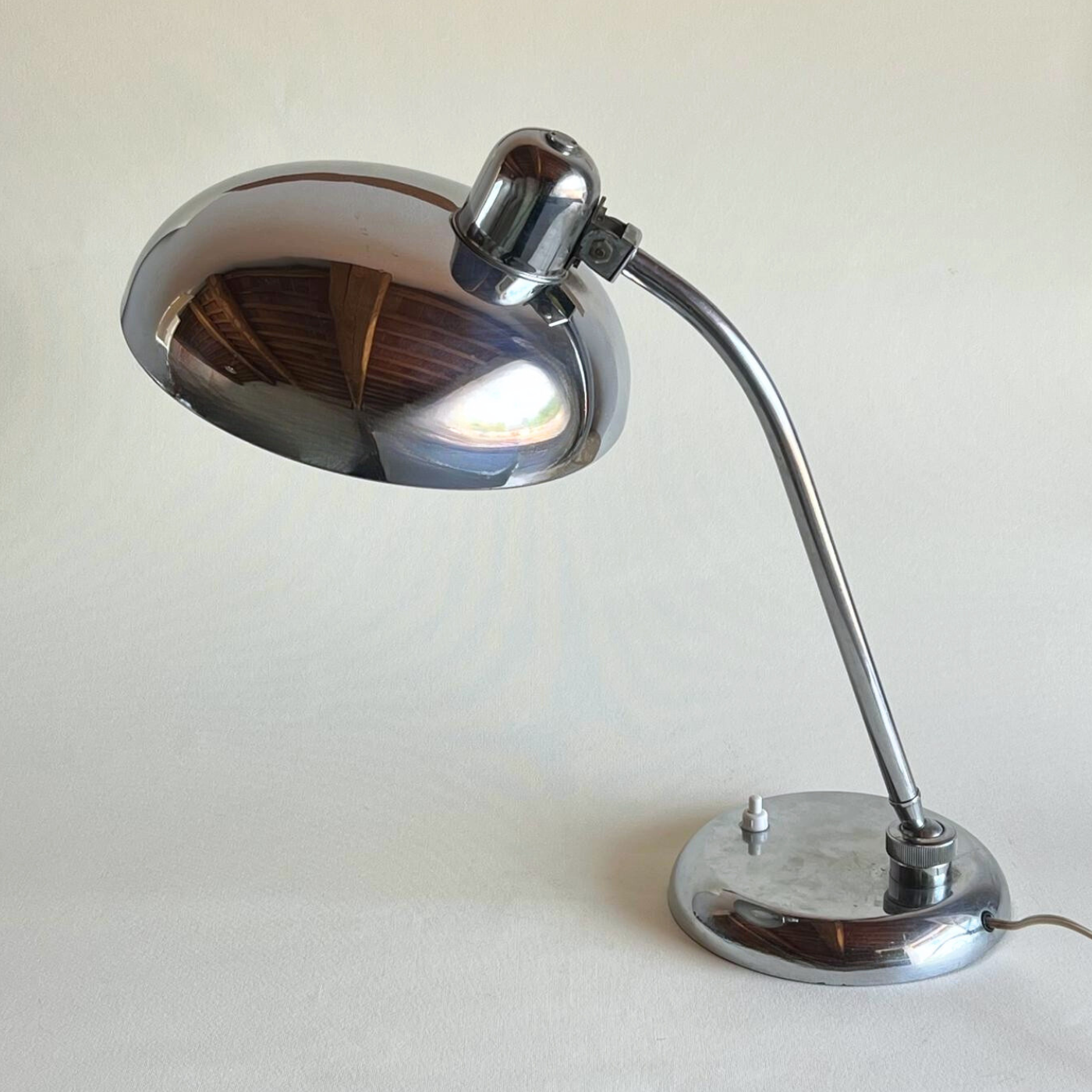 Vintage chrome lamp with reflective base