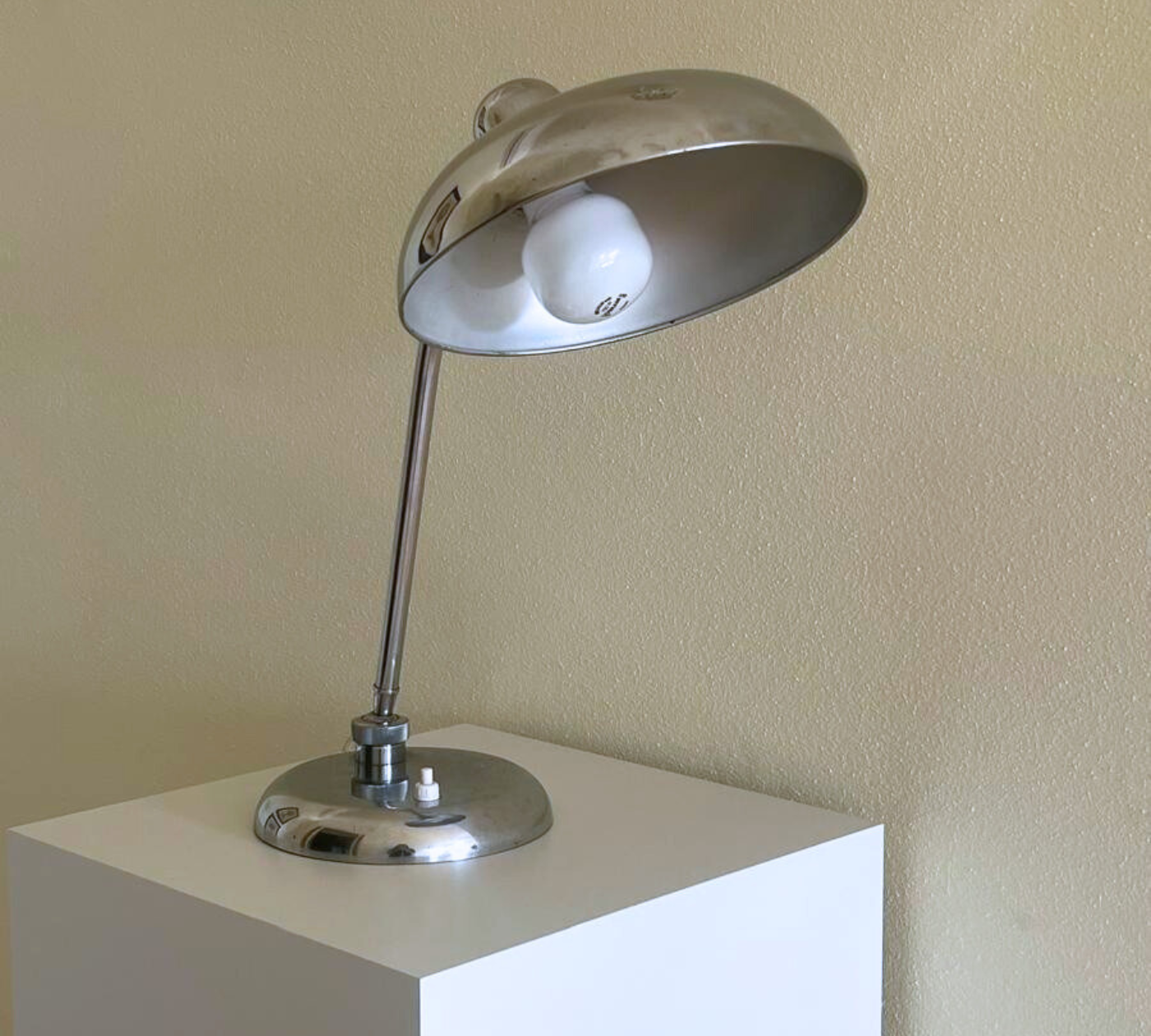 Vintage chrome lamp with subtle patina scratches