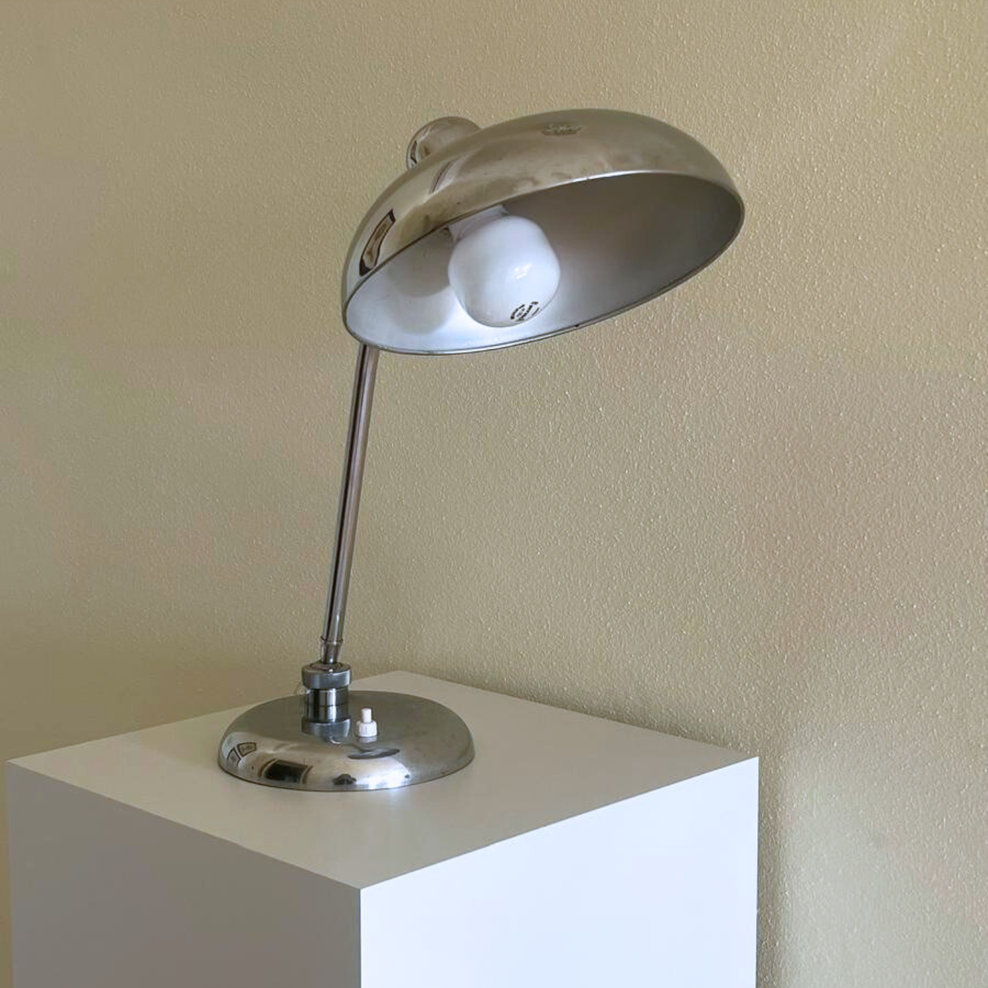 Vintage chrome lamp with subtle patina scratches