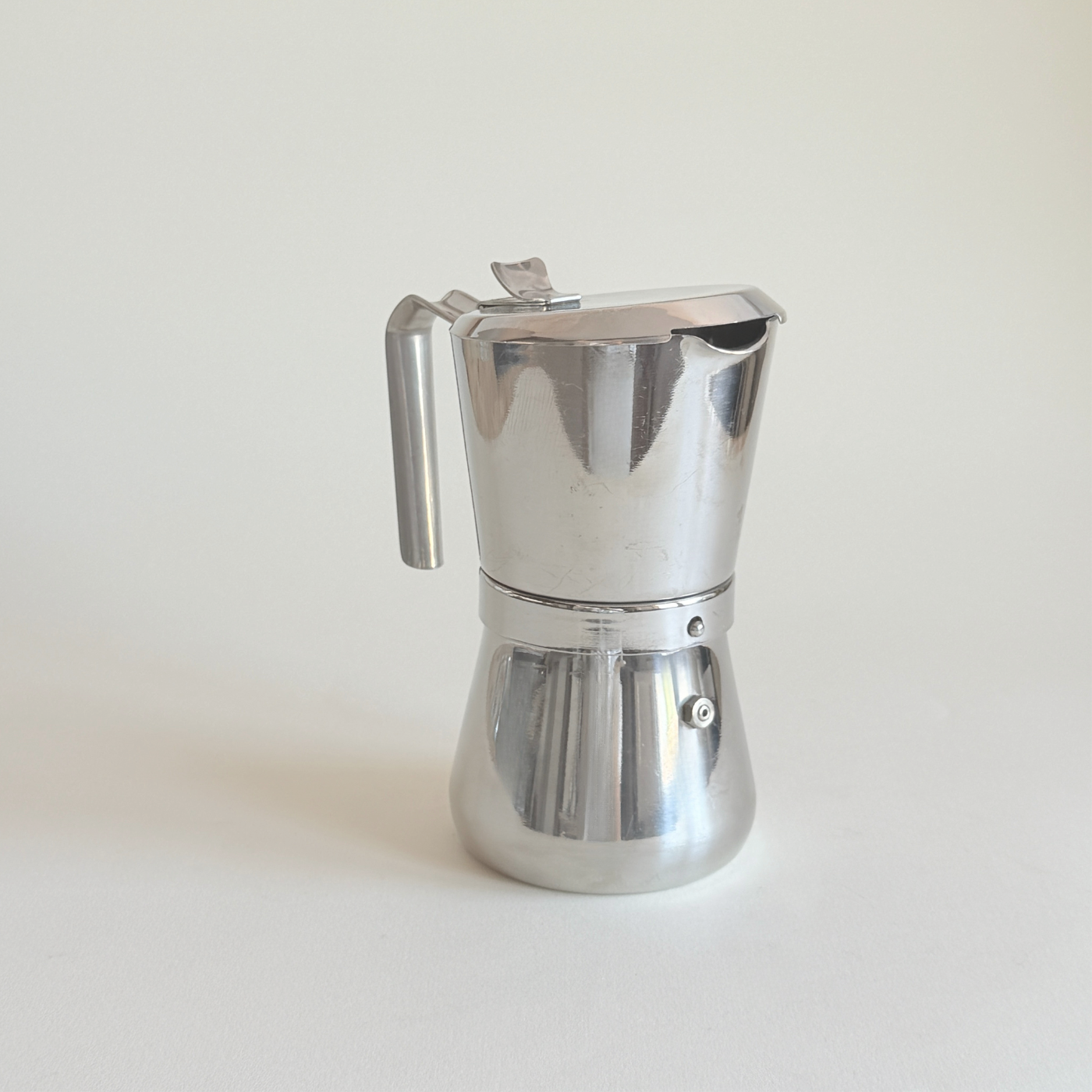 Giannina stainless steel moka pot by Giannini, mirror polished silver with cast steel handle