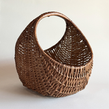 1970s Italian rattan crescent moon basket with dark close weave