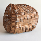 1970s Italian rattan crescent moon basket with dark close weave