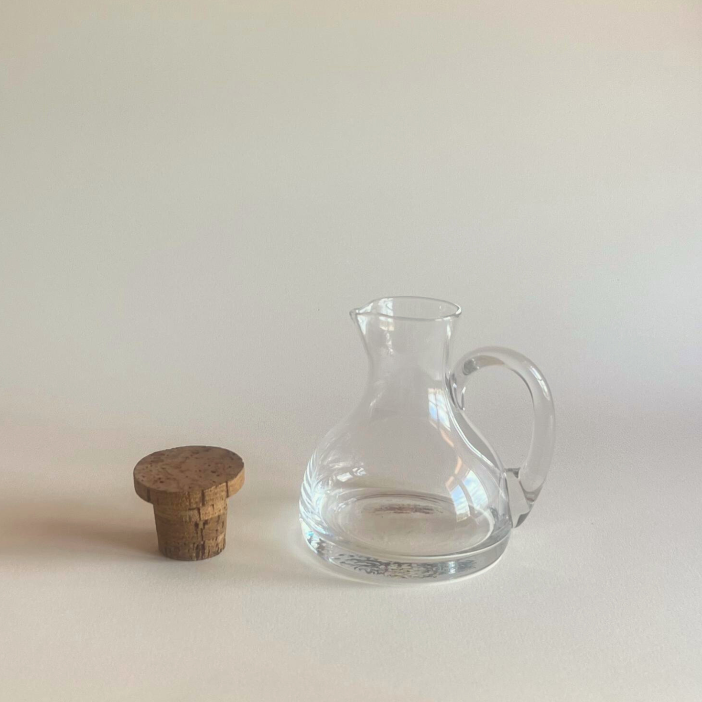 Elegant small crystal jug with natural cork top