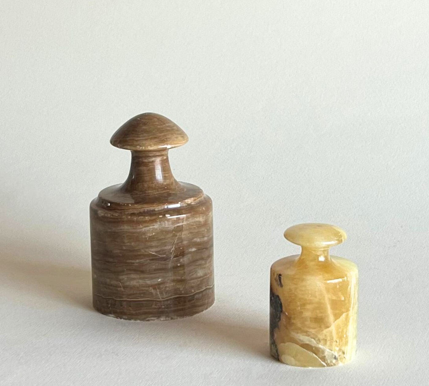 Brown and yellow onyx paperweights