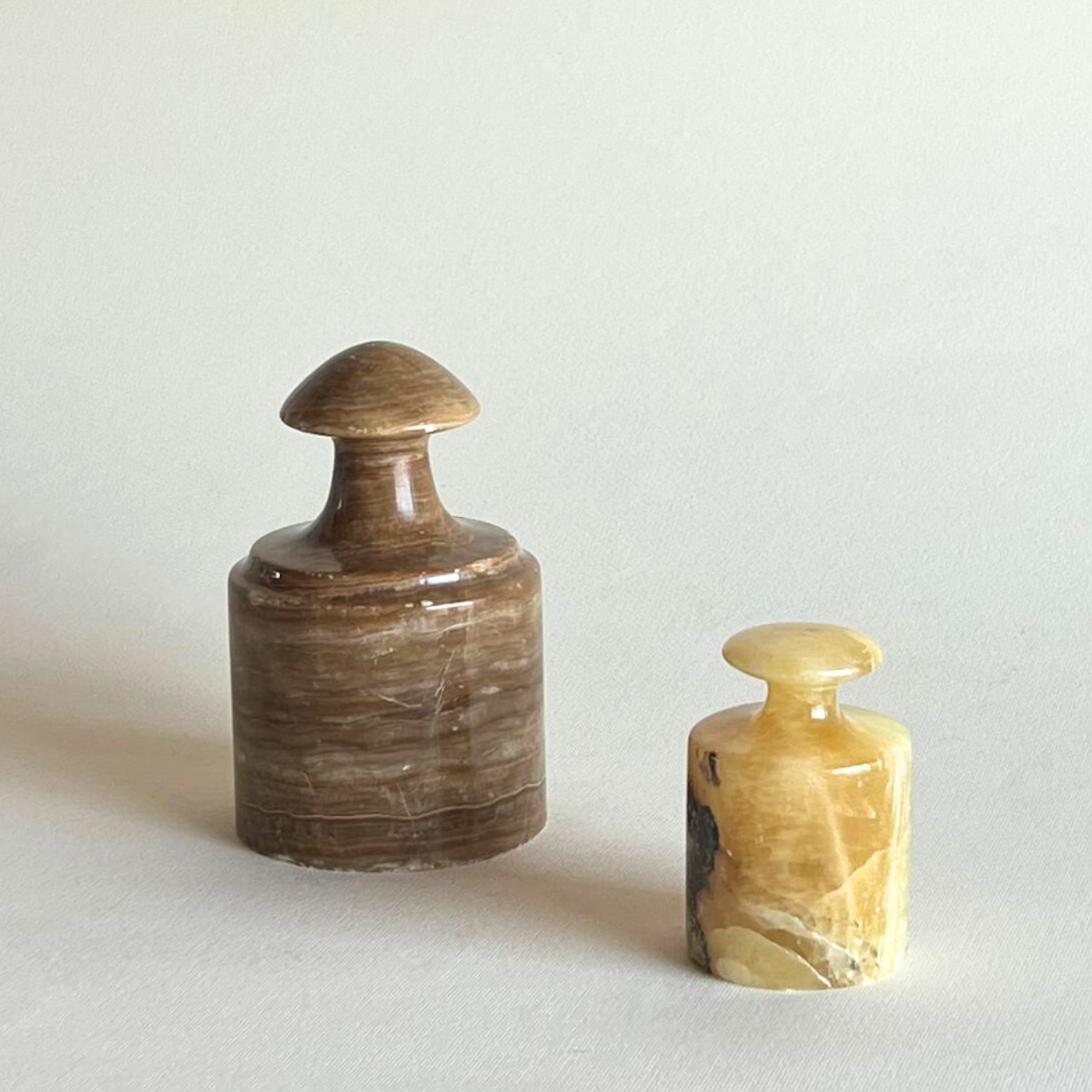 Brown and yellow onyx paperweights