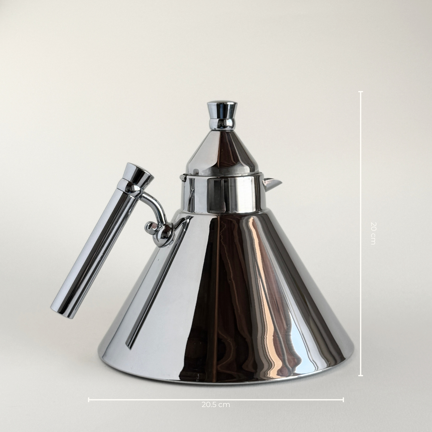 Stainless steel kettle with clean geometric form and ergonomic handle