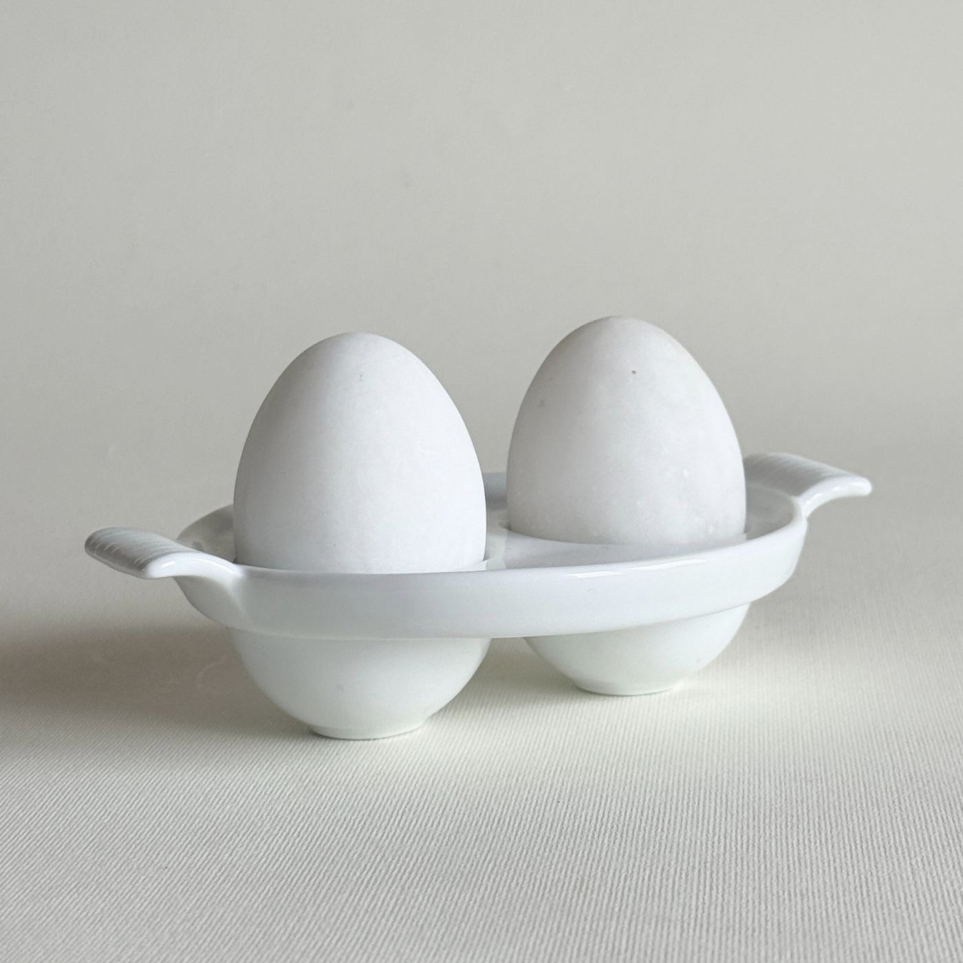 white ceramic double egg cup