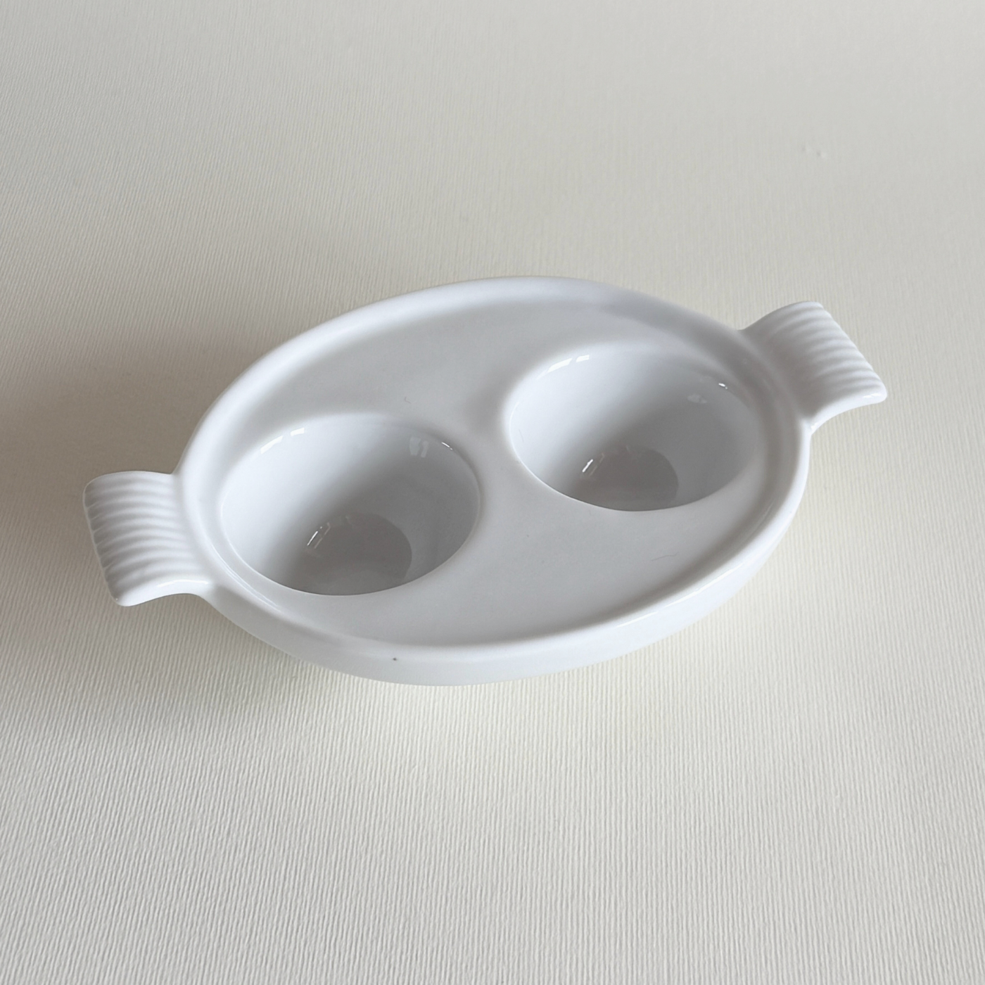 white ceramic double egg cup