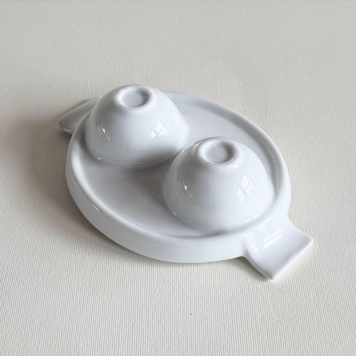 white ceramic double egg cup