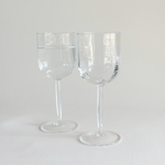 Italian ribbed red wine glasses — set of 2, front view showing wide ribbed bowl and hexagonal geometric stem, 2000s Italian production