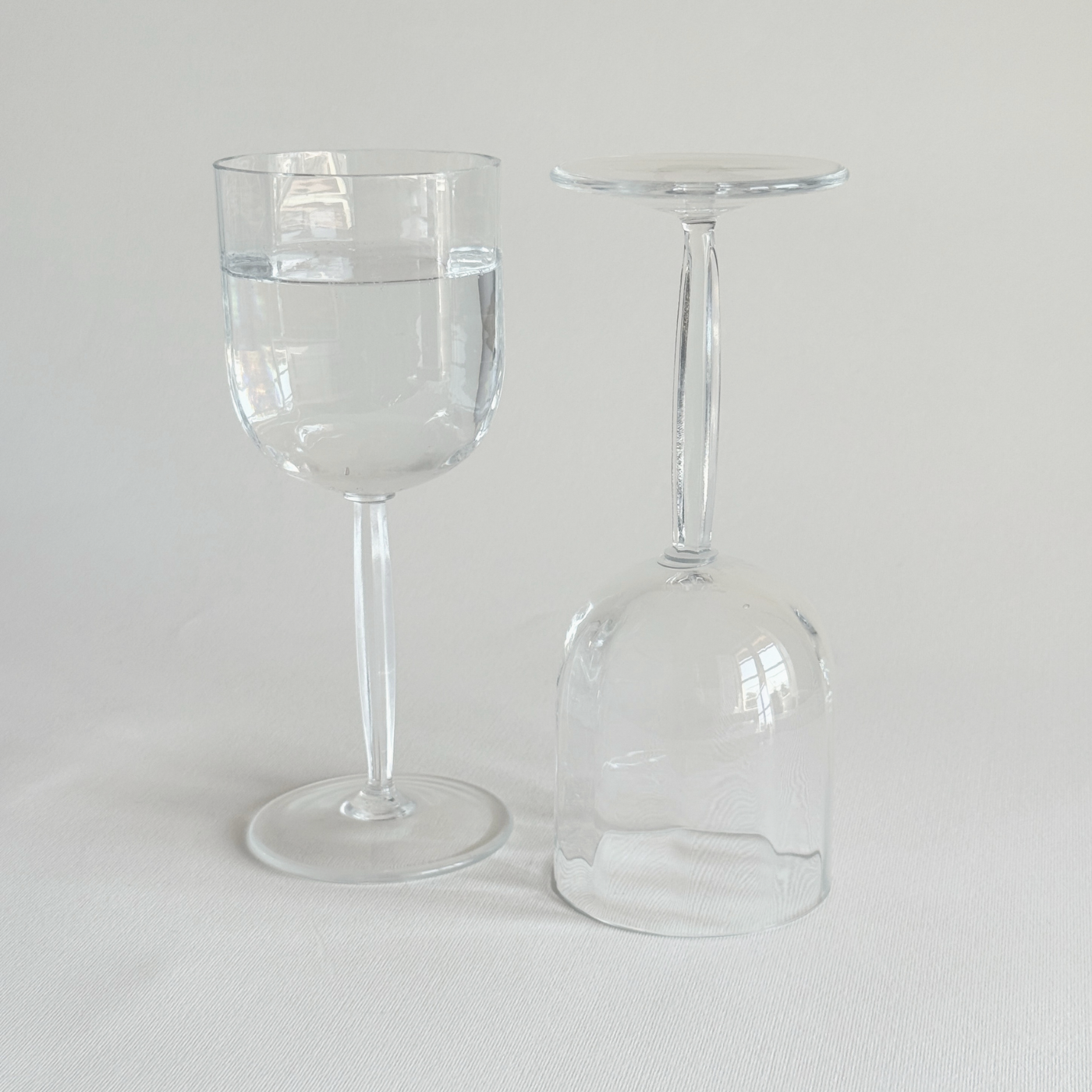 Italian ribbed red wine glasses — close-up of hexagonal geometric stem showing faceted form and secure grip