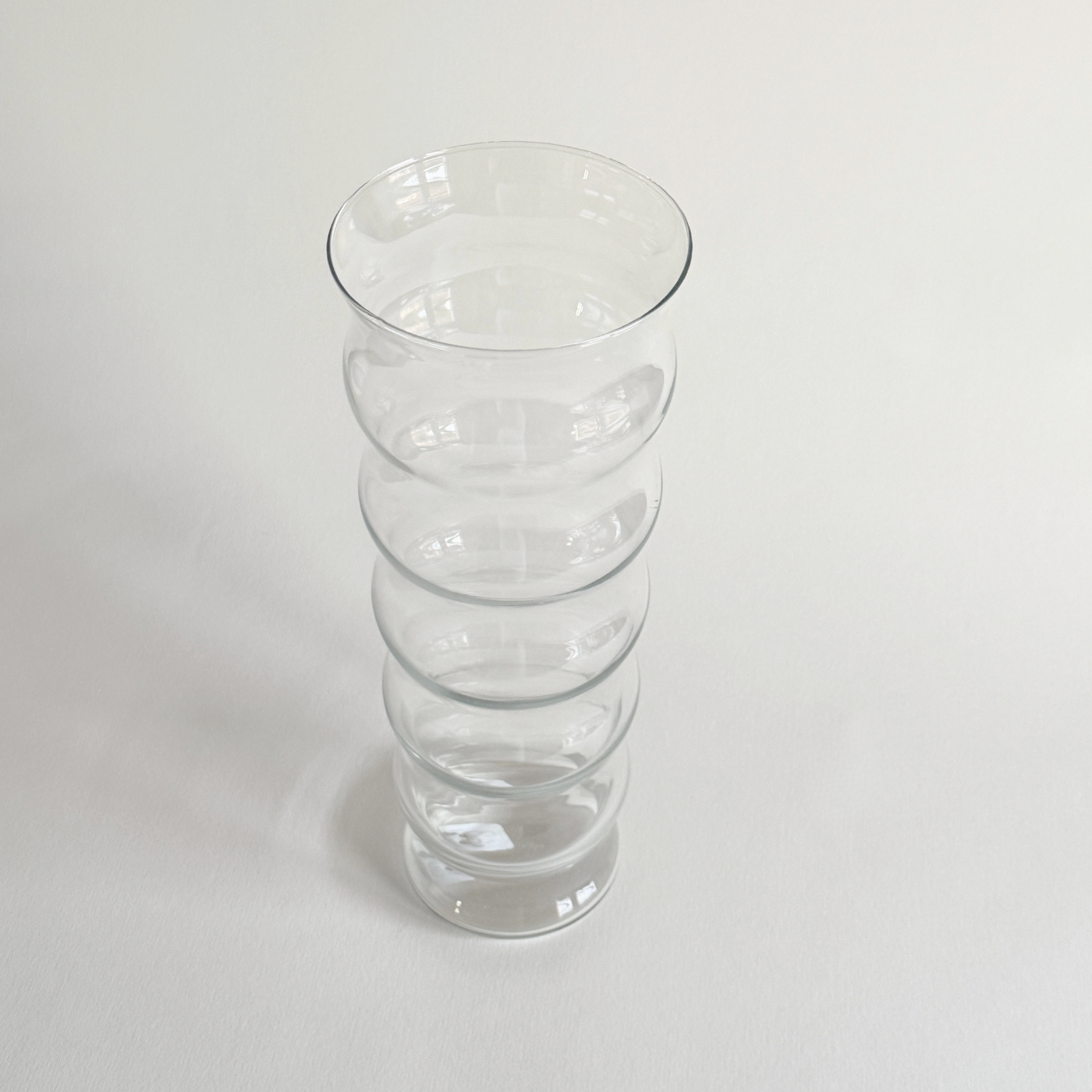 Ripple glass vase showing the vertical ribbing catching the light