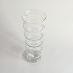 Ripple glass vase showing the vertical ribbing catching the light