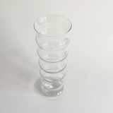 Ripple glass vase showing the vertical ribbing catching the light