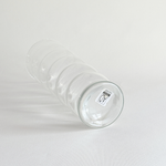 Clear rippled glass vase in profile with flared form