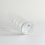 Clear rippled glass vase in profile with flared form