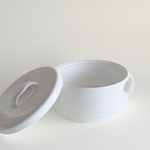 White ceramic tureen — three-quarter view showing lid handle and clean white glaze