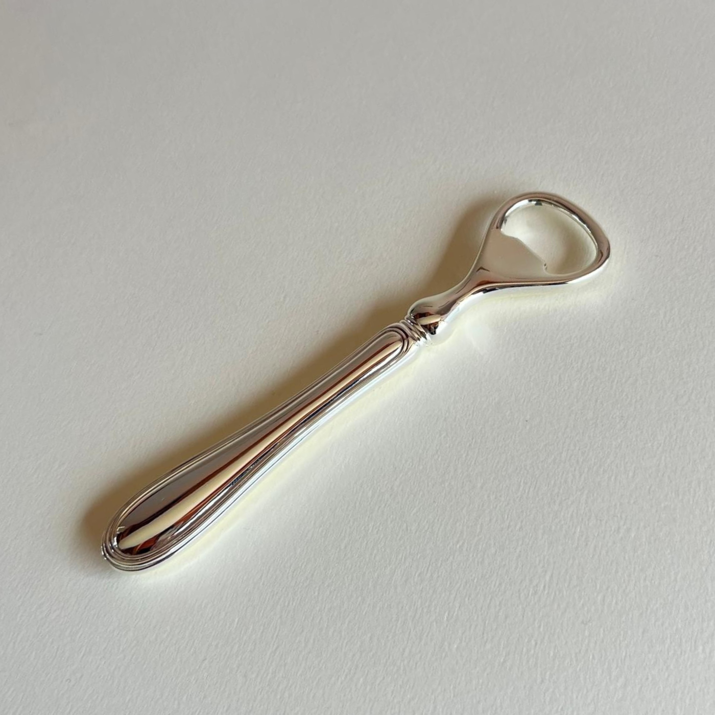 silver plated bottle opener with original packaging