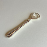 silver plated bottle opener with original packaging
