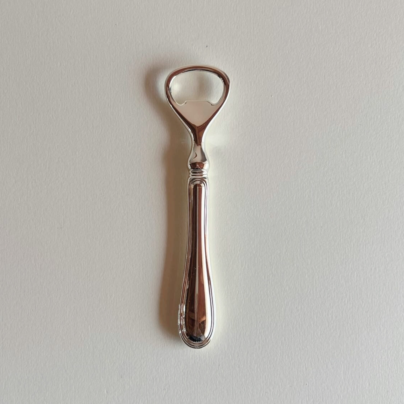 Collectible silver plated bottle opener