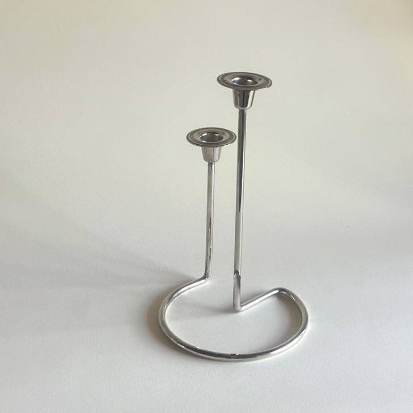 Vintage silver candlestick in polished metal finish