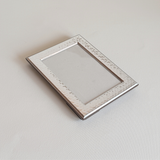 Hand-worked silver plated picture frame, hammered silver face on brown mahogany, 13 x 17 cm