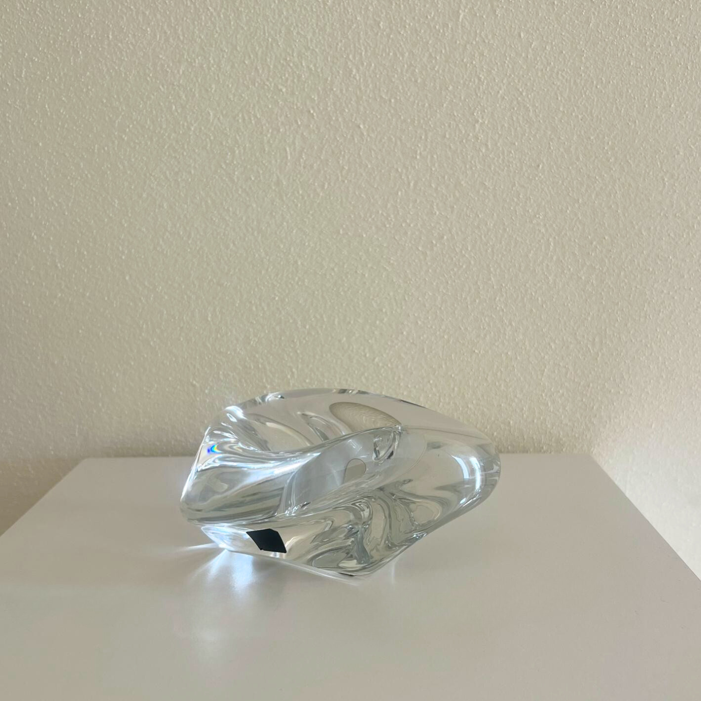 Elegant crystal ashtray reflecting natural light