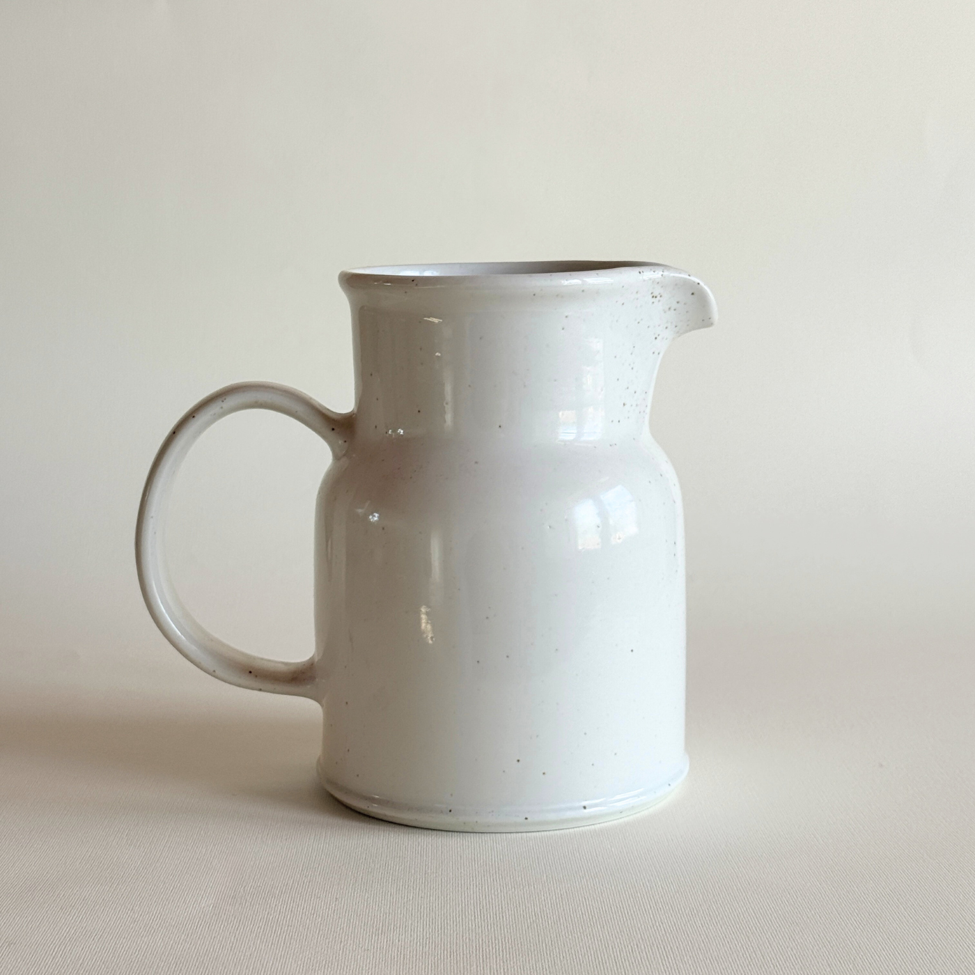 White stoneware pentik jug with brown splatter pattern kitchen ware