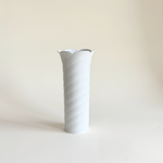 Slender white swirl-relief vase in glazed porcelain, narrow 7 cm base, made in Germany in the 2000s