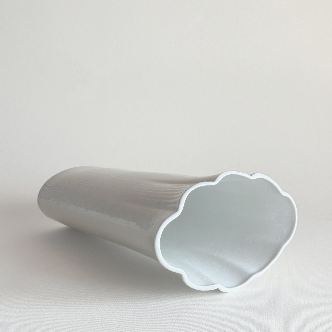 White ceramic vase — base view showing underside and overall condition
