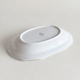 White porcelain rectangular tray in profile showing the low raised edge
