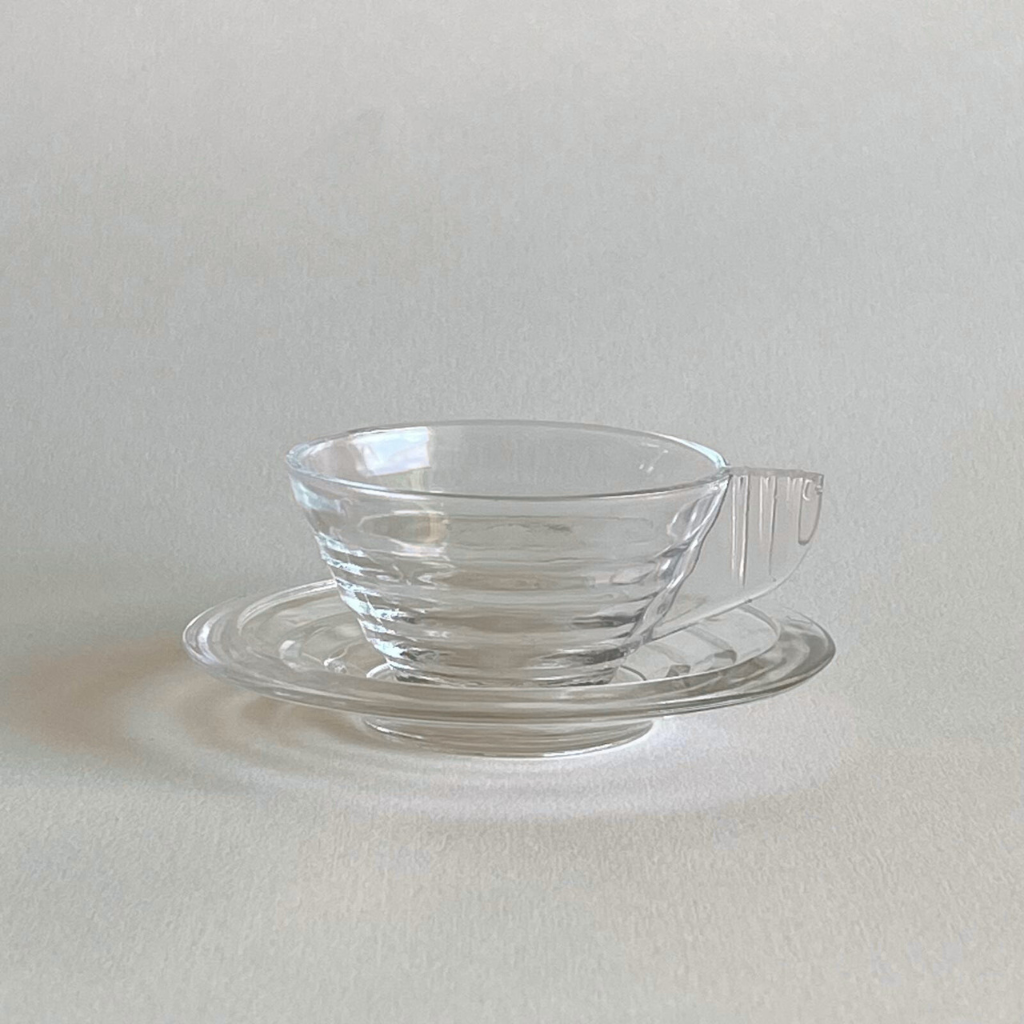 Elegant vintage Arcopal espresso cup and saucer profile view