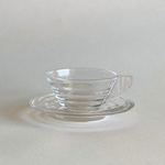 Elegant vintage Arcopal espresso cup and saucer profile view