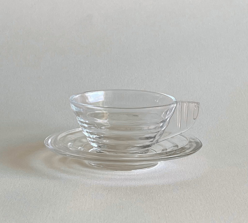 Elegant vintage Arcopal espresso cup and saucer profile view