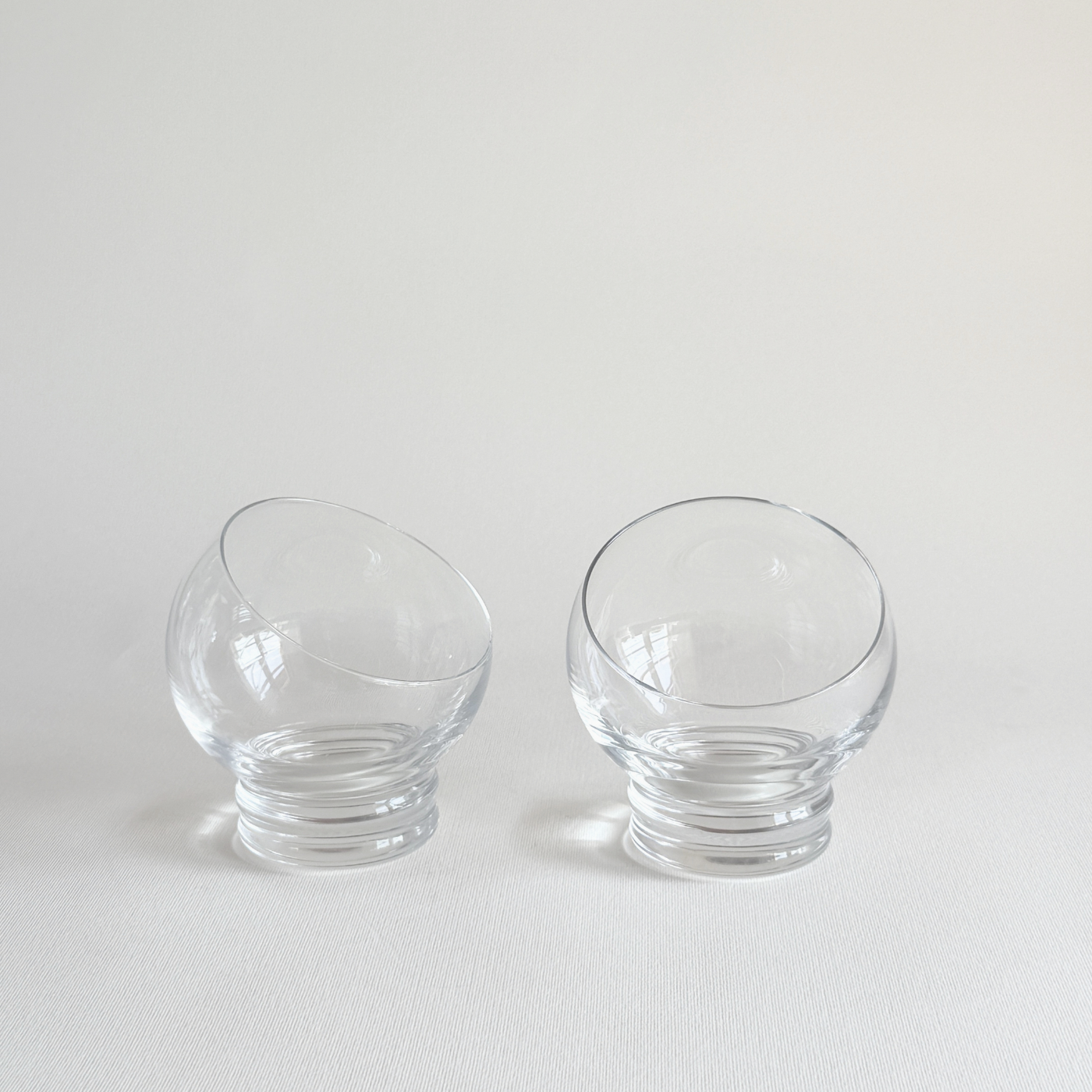Italian Space Age ball cocktail glasses — set of 2, front view showing spherical bowl form, clear glass, 1970s Italian design