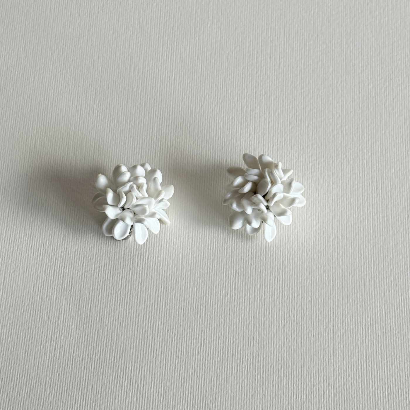 Elegant three-dimensional white floral earrings