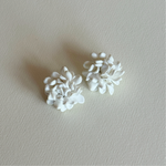 White floral clip earrings 2.5cm diameter, 1.8cm height close up