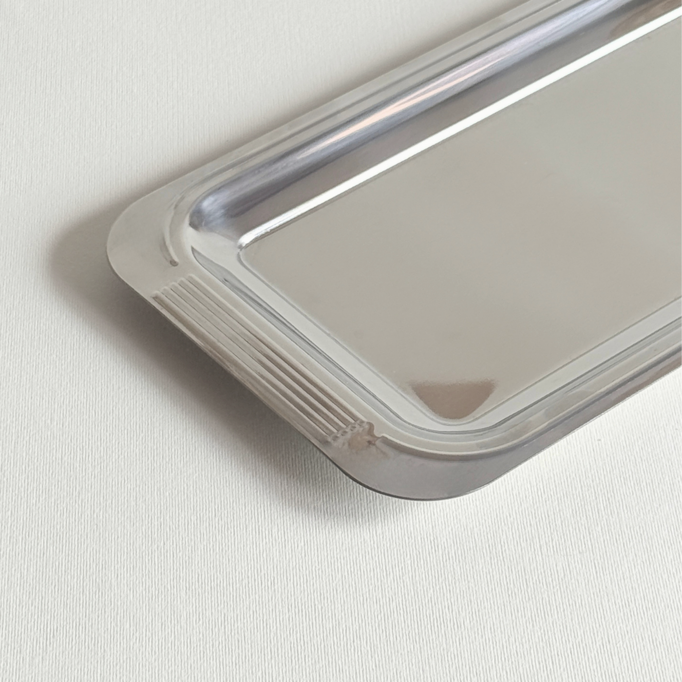 Guy Degrenne Mirrored Tray 28x15 cm polished stainless steel with ribbed handles