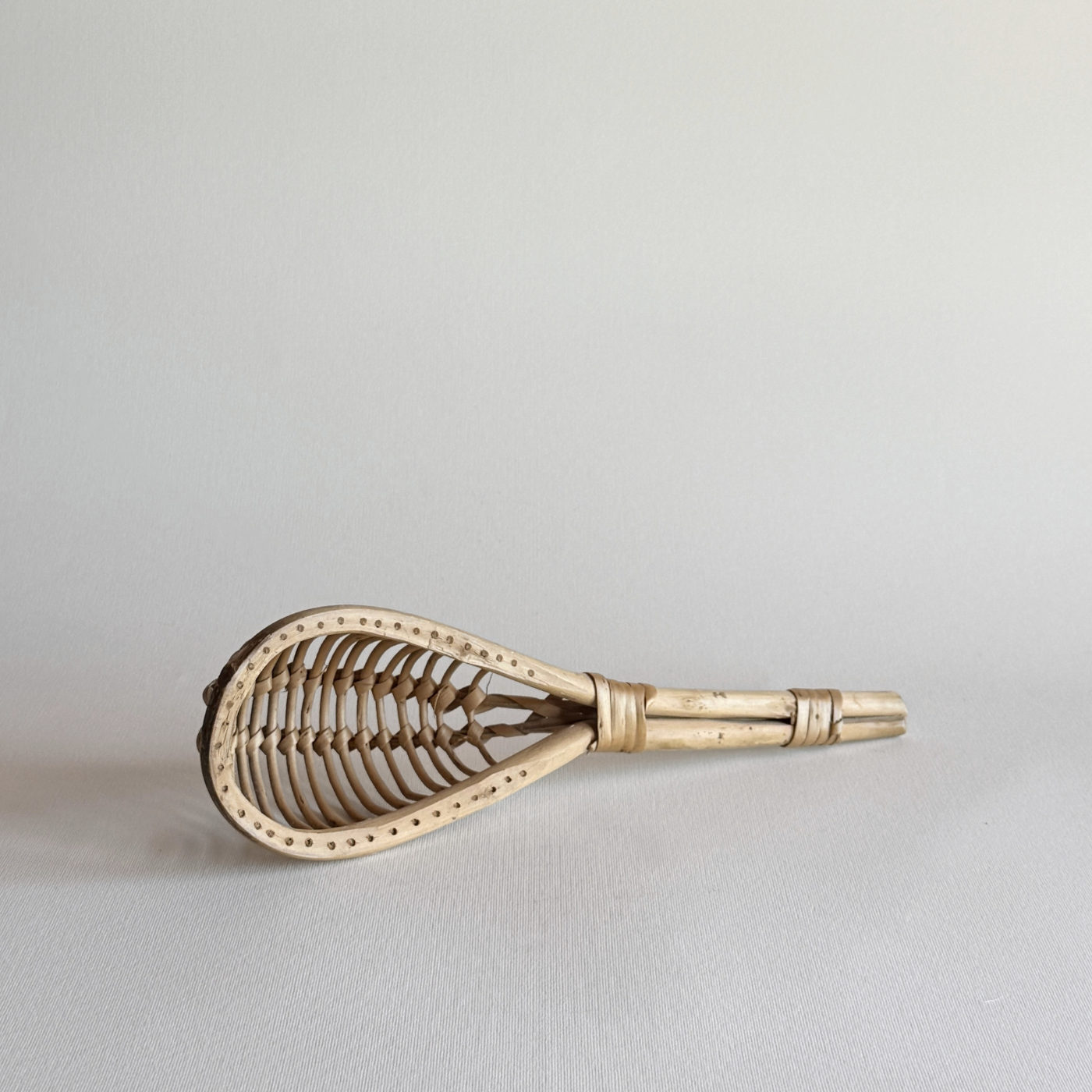 1960s Italian rattan kitchen colander with elongated open-weave design