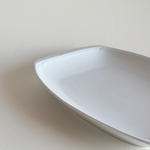 Ceramic Serving Dish in white glazed ceramic with rounded corners and a subtle raised leaf-relief border detail.