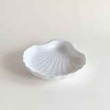 White Italian porcelain shell-form oven dish on a neutral surface