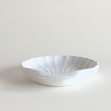 Shell oven dish viewed from above, showing the fluted ridges