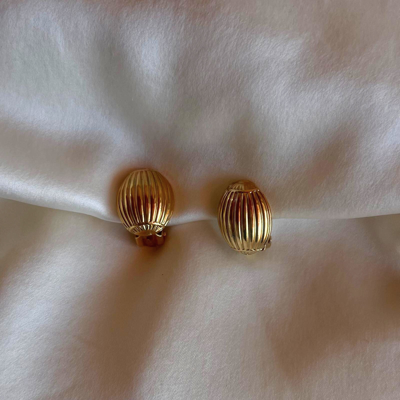 Refined gold oval clip earrings, subtle statement accessory